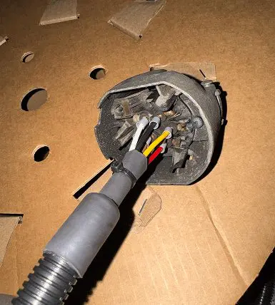 Vehicle wiring being prepared during an auto electrical repair